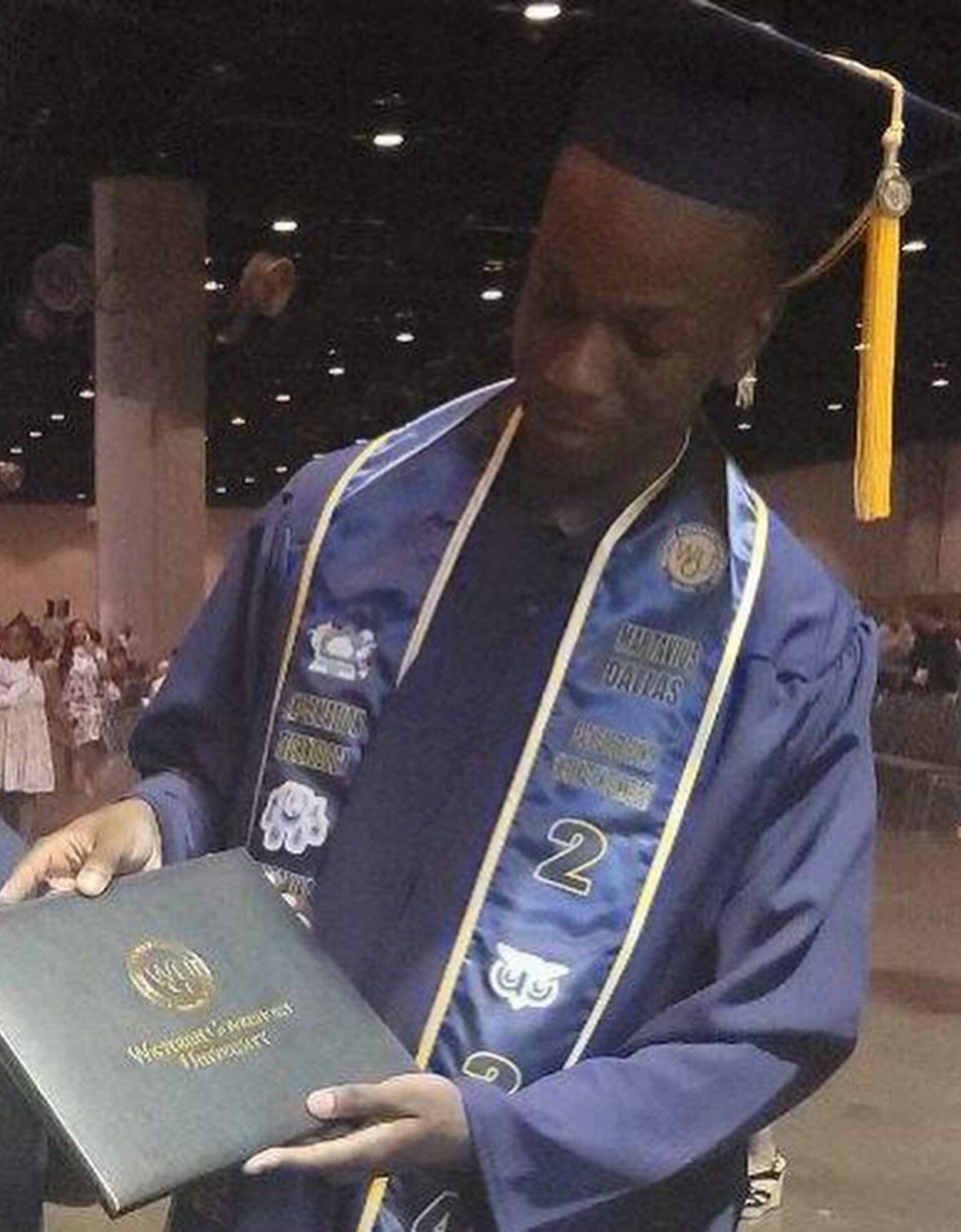 Martavius Dallas walking the stage at his Western Governors University graduation ceremony